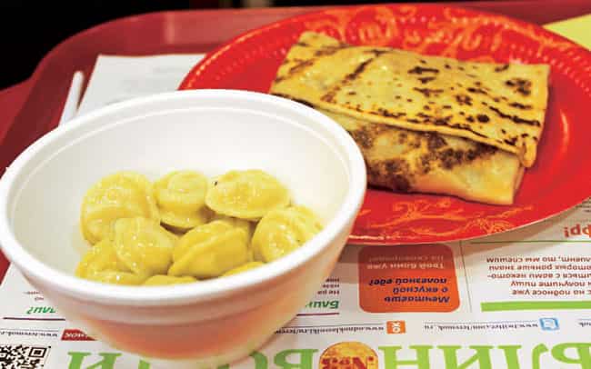 Pelmeni (foreground) and blin) Pelmeni (foreground) and blin)